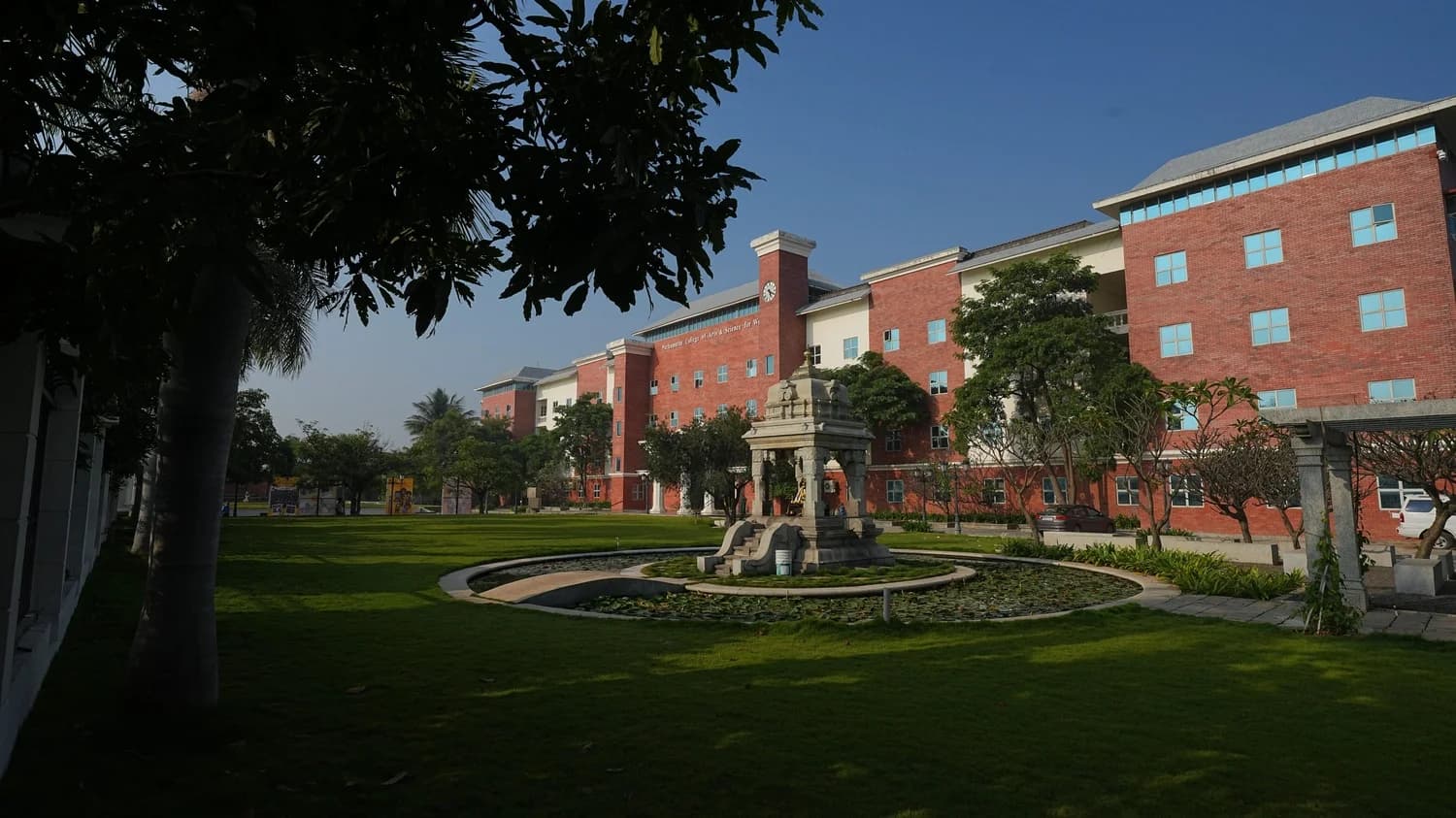 Students walking together outside the main academic block